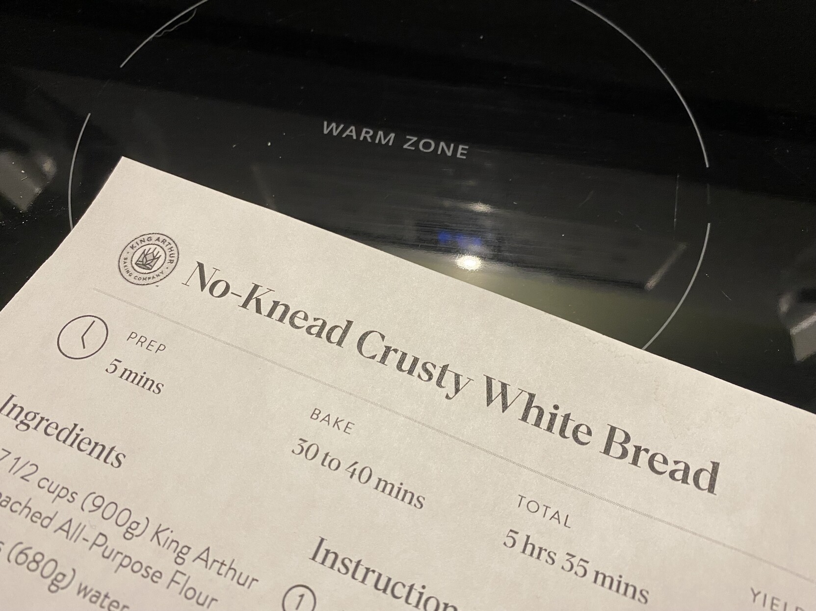 a photo of a printed recipe for “no knead crusty white bread” 