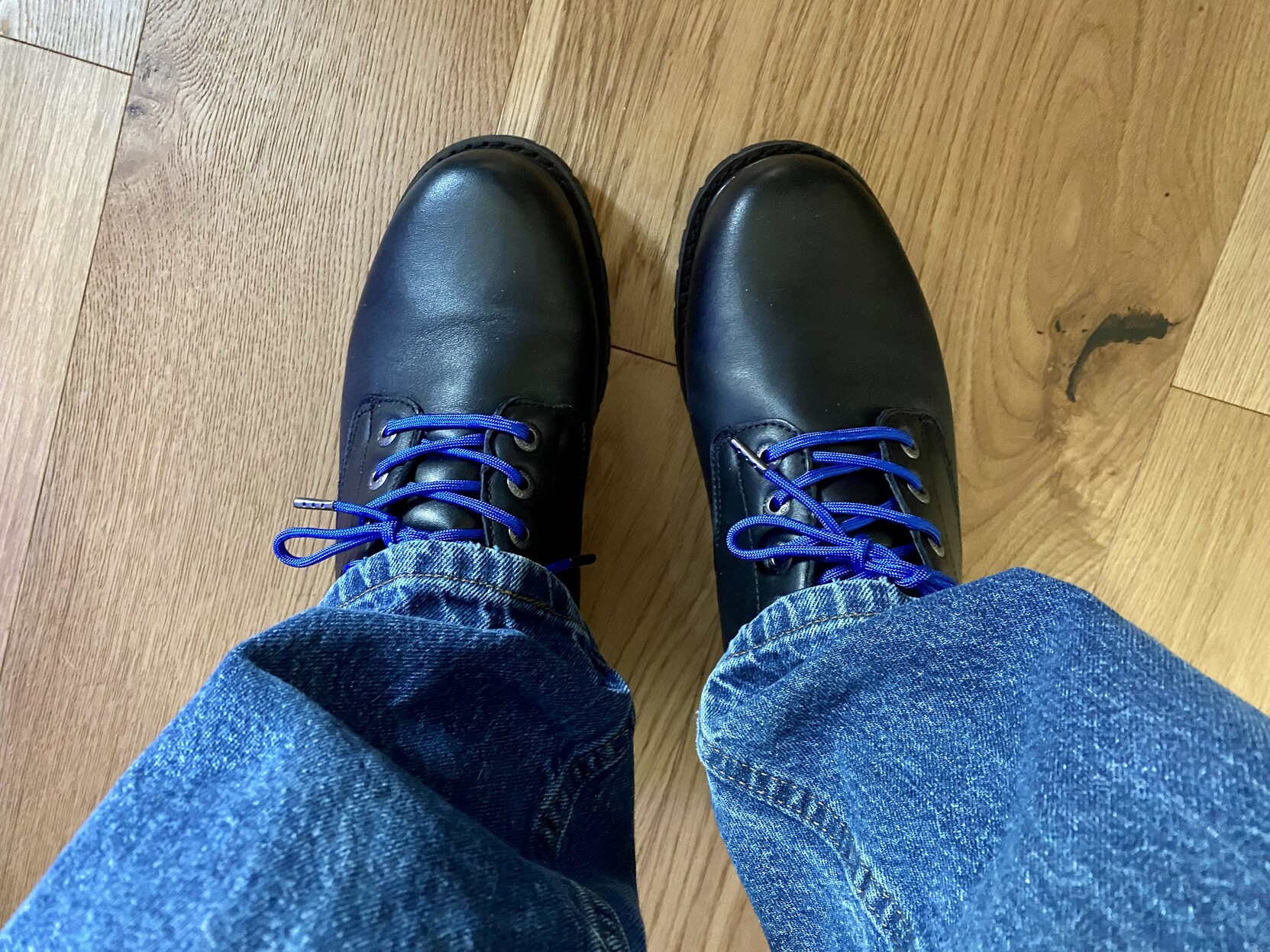 a photo of my new black oxford shoes with blue paracord laces