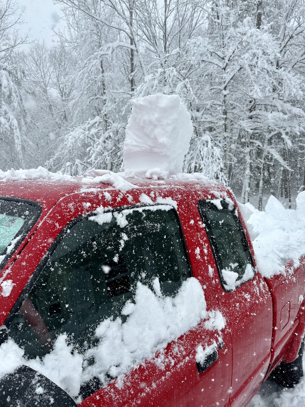 a photo of the top of my truck with a chunk of snow left on top of it