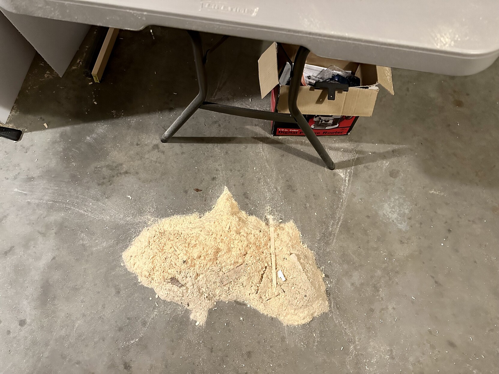 a photo of a fairly large pile of sawdust on my garage floor. 