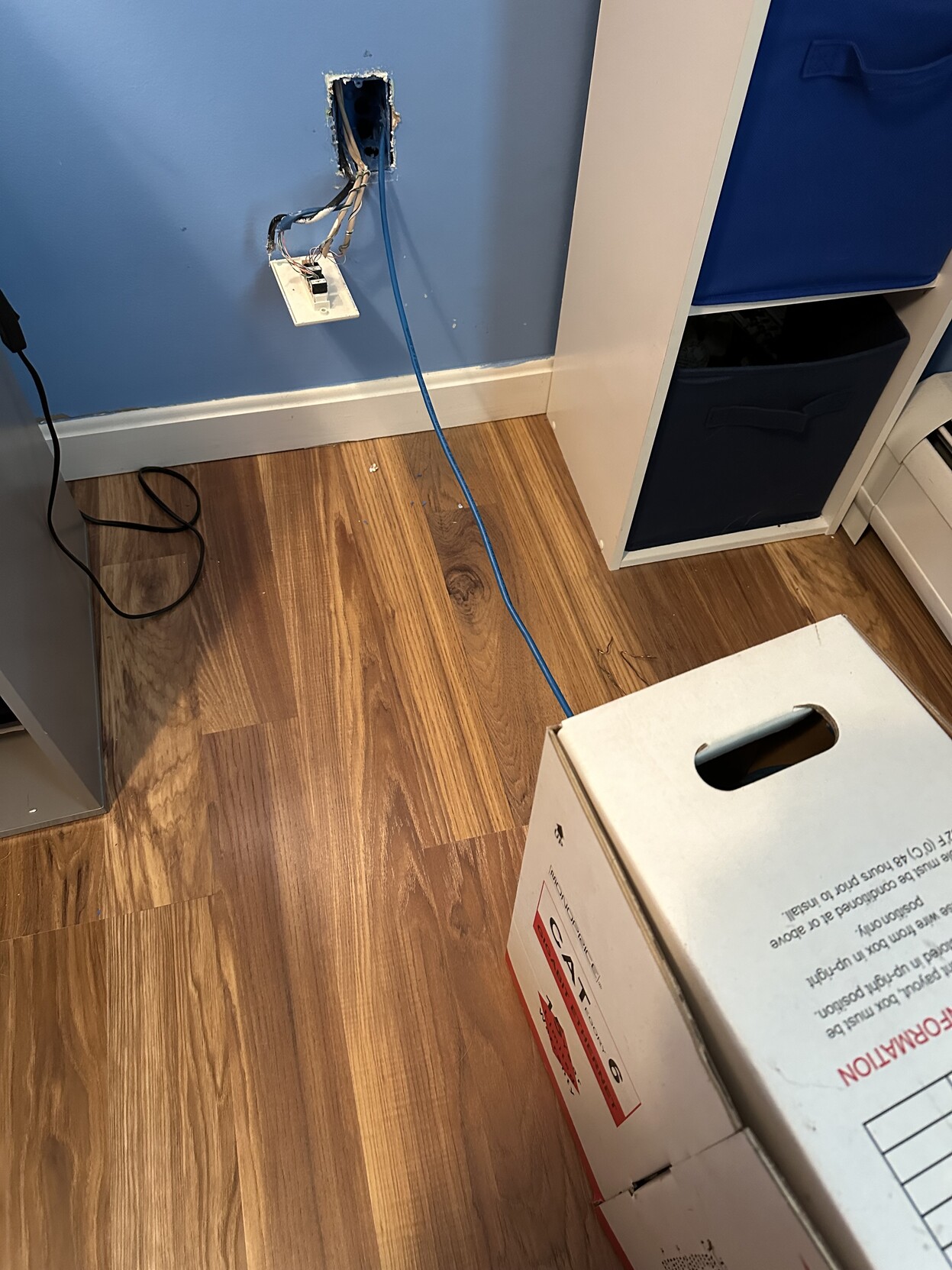 a photo of a spool of cat6 ethernet cable where i was pulling it through a wall