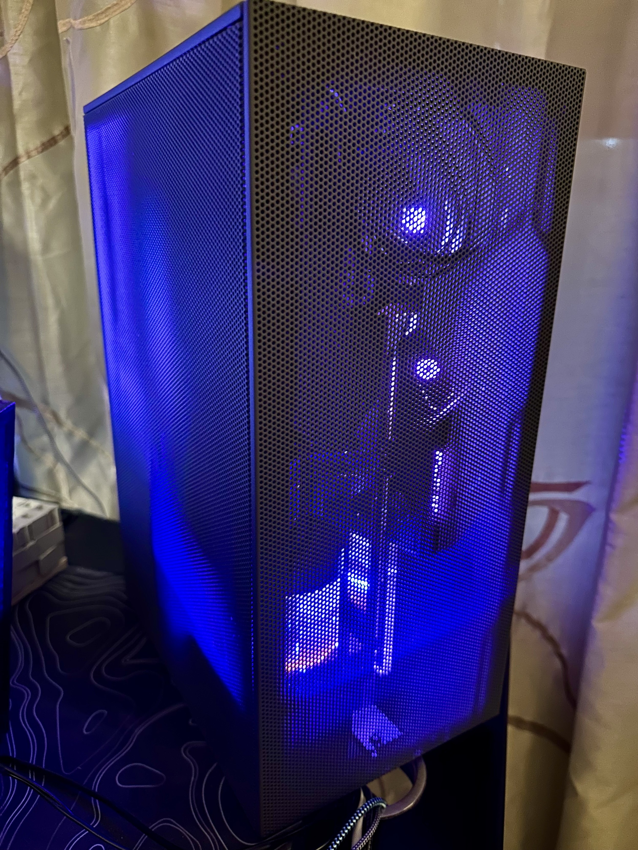 a photo of my custom water cooled PC with the sides installed and you can see the components shining through the mesh. 