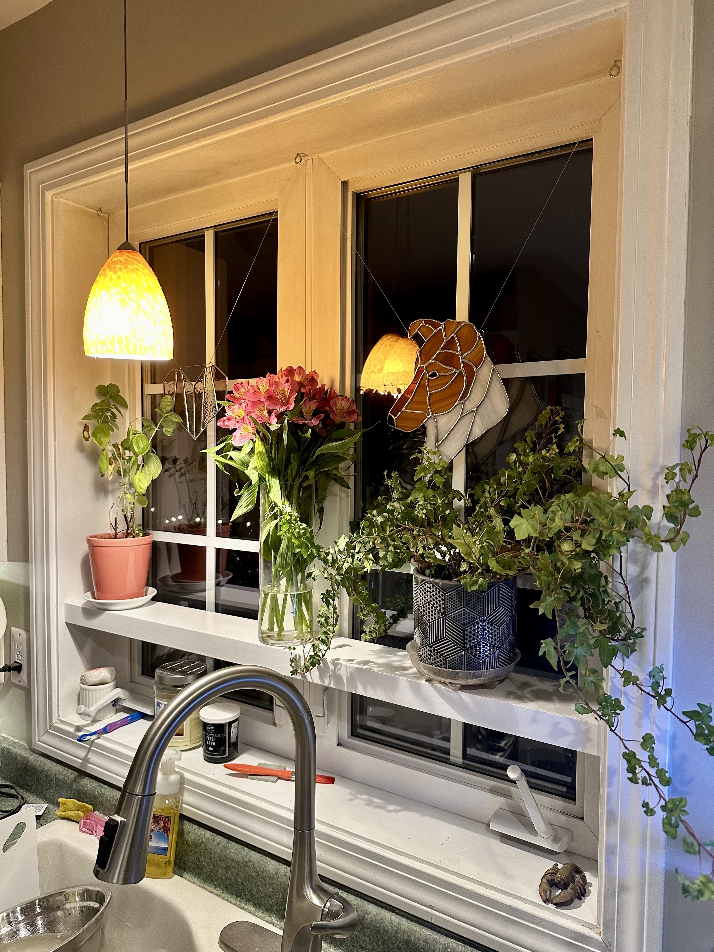 a photo of the shelf i made for our kitchen window 