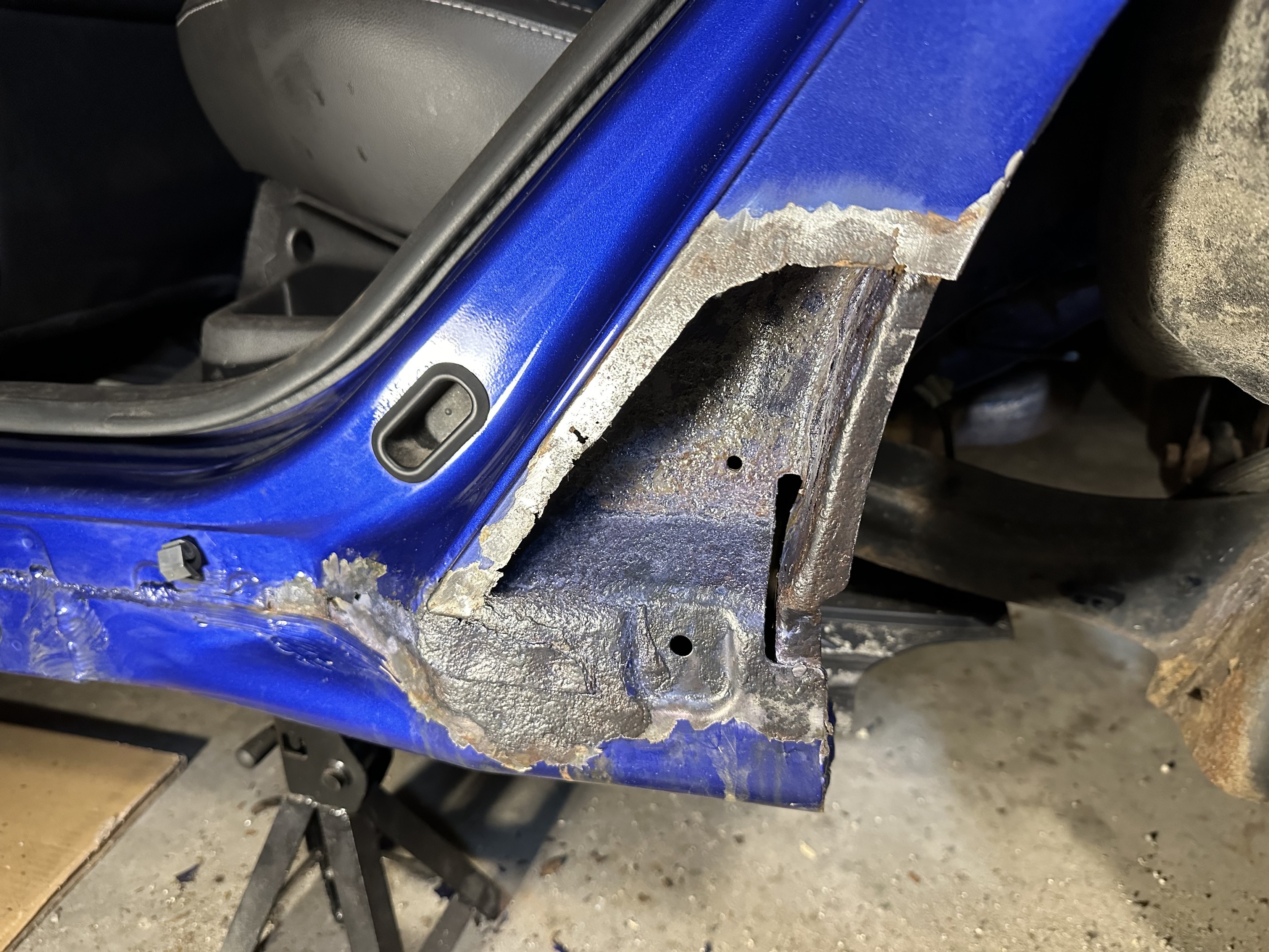 a photo of the area of my car that needed repair, after i’ve cleaned out the rust and treated it with an inhibitor