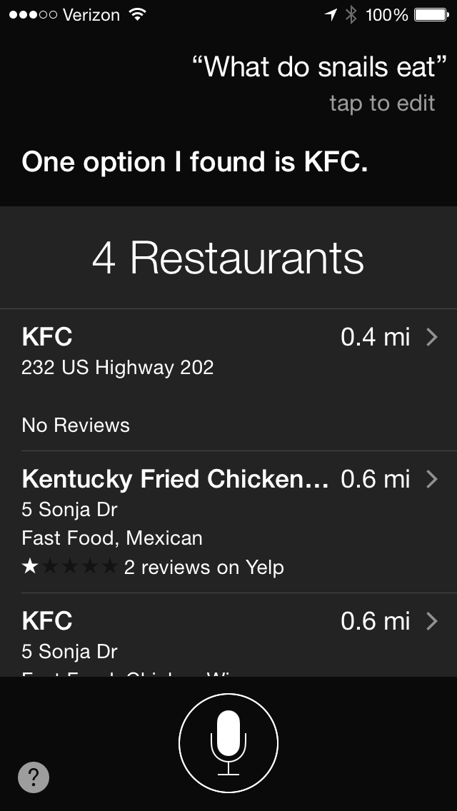 a screenshot asking Siri “what do snails eat” and Siri suggests KFC nearby. 