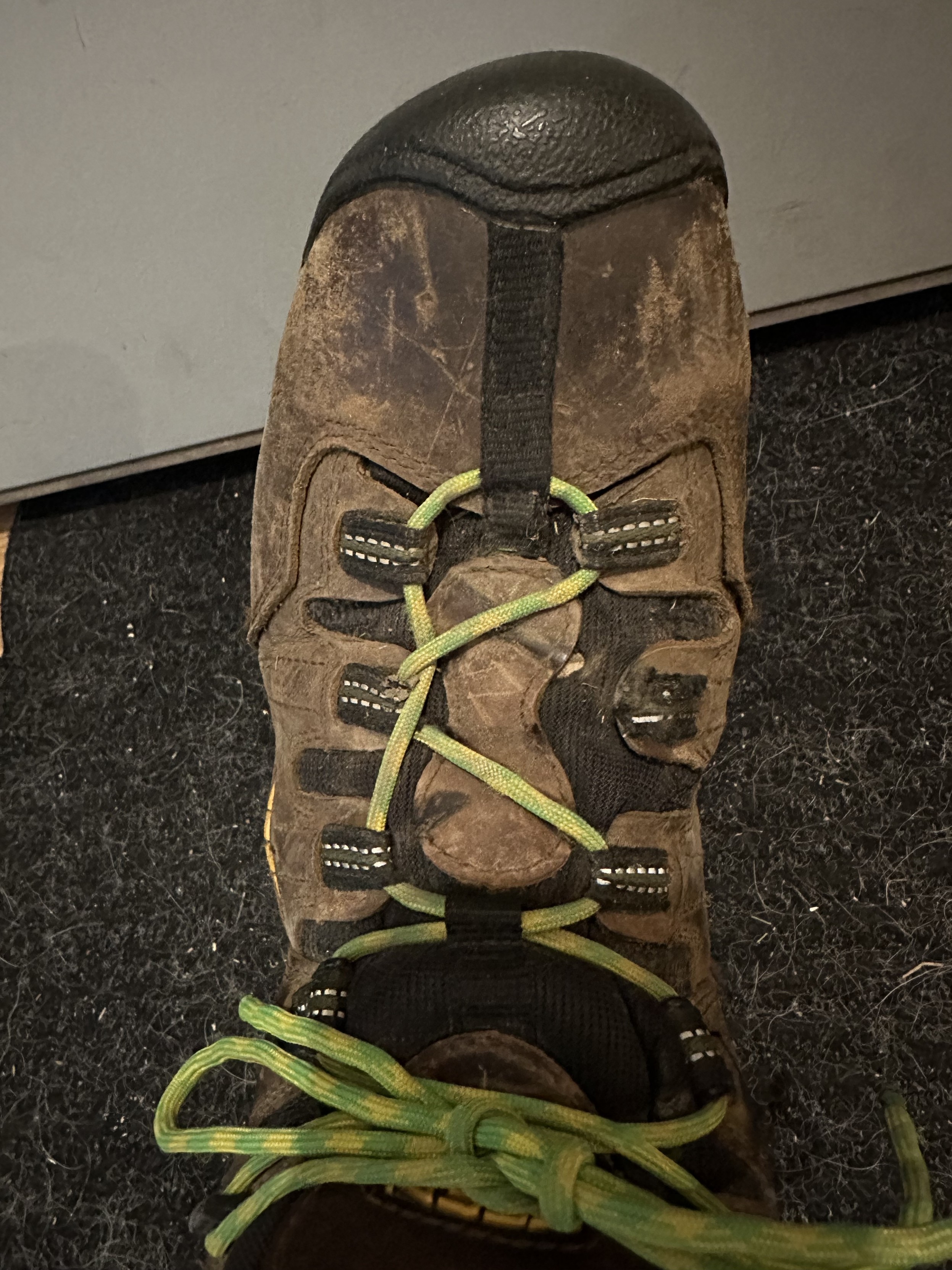 a photo of one of my boots. a loop that you thread your laces through has broken. 