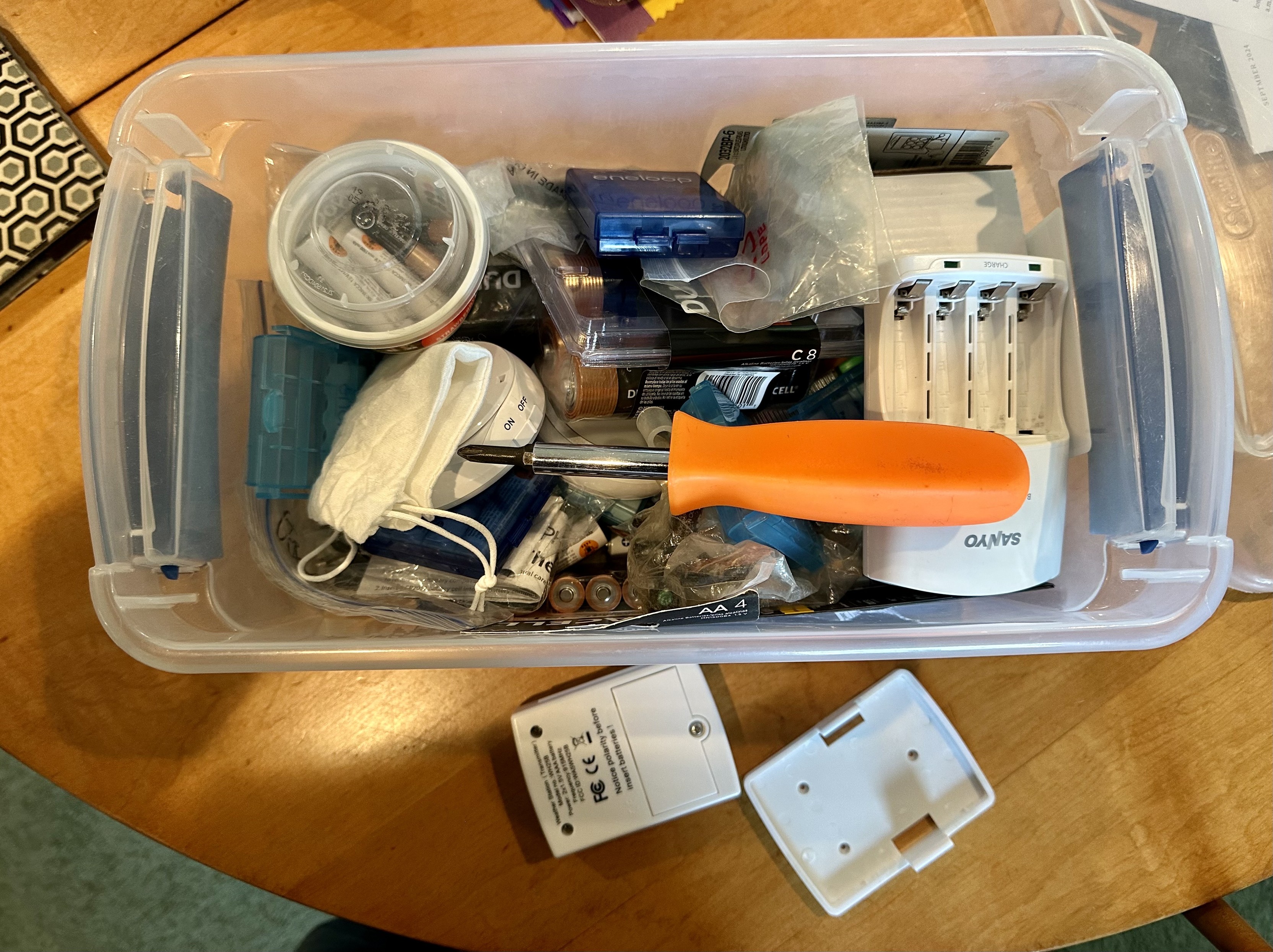 a photo of the “battery box” i keep in my house. it has alkalines but also many many eneloop rechargeables. 