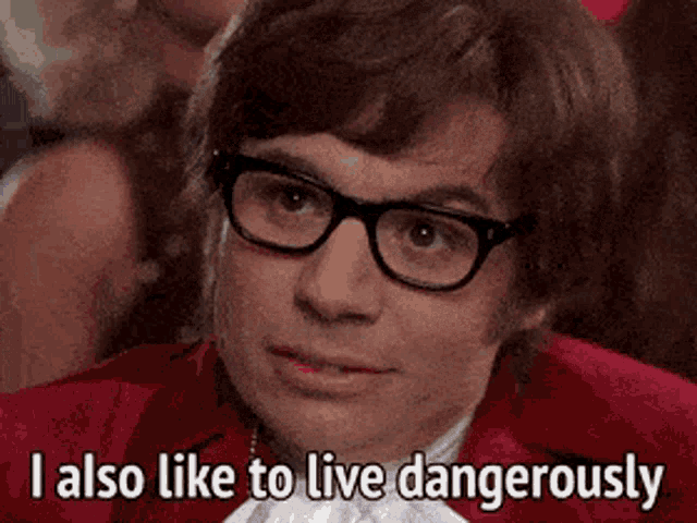 a photo of mike meyers character “austin powers” saying “i also like to live dangerously”