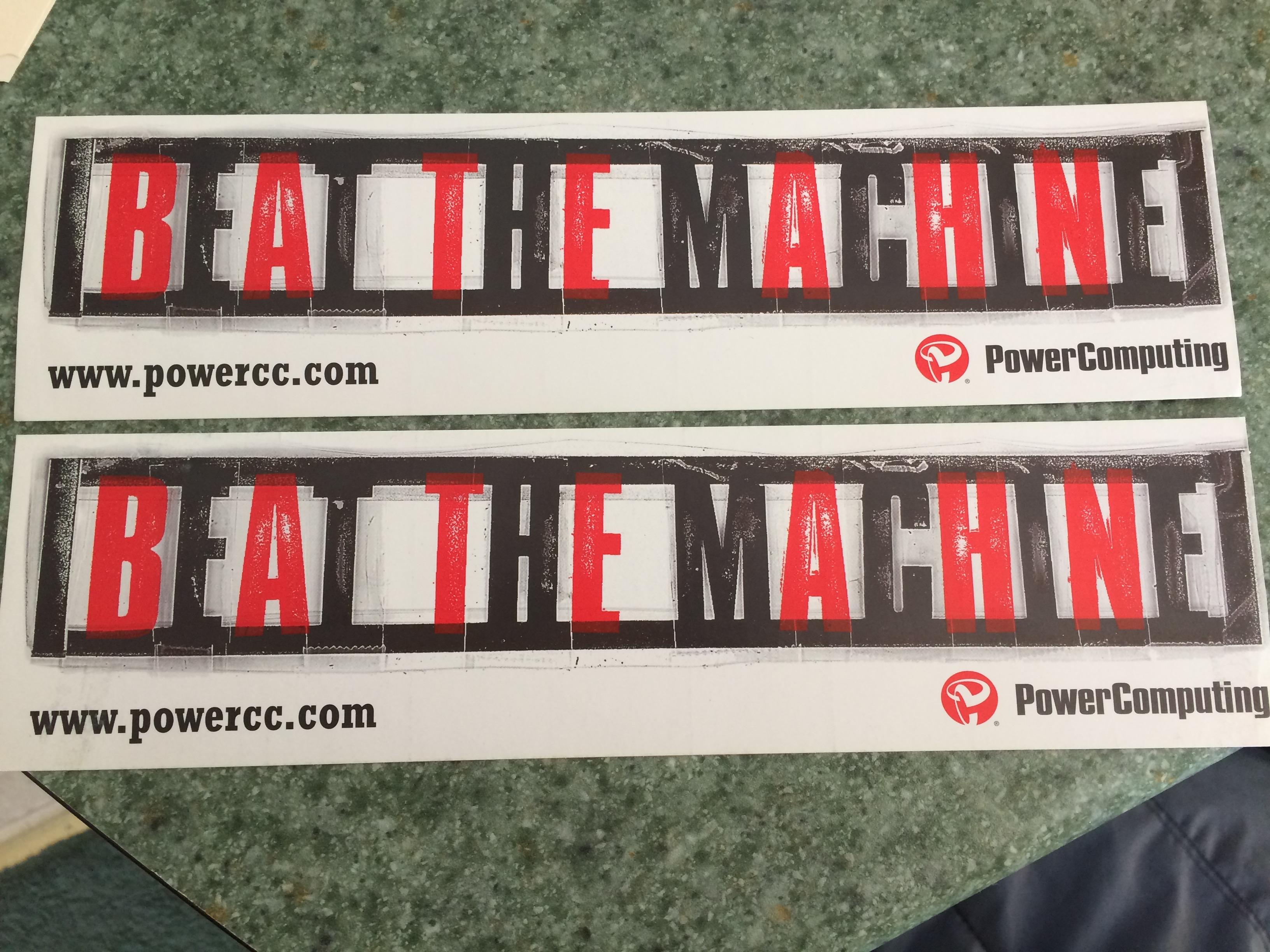a photo of a bumper sticker from power computing that says “beat the machine”