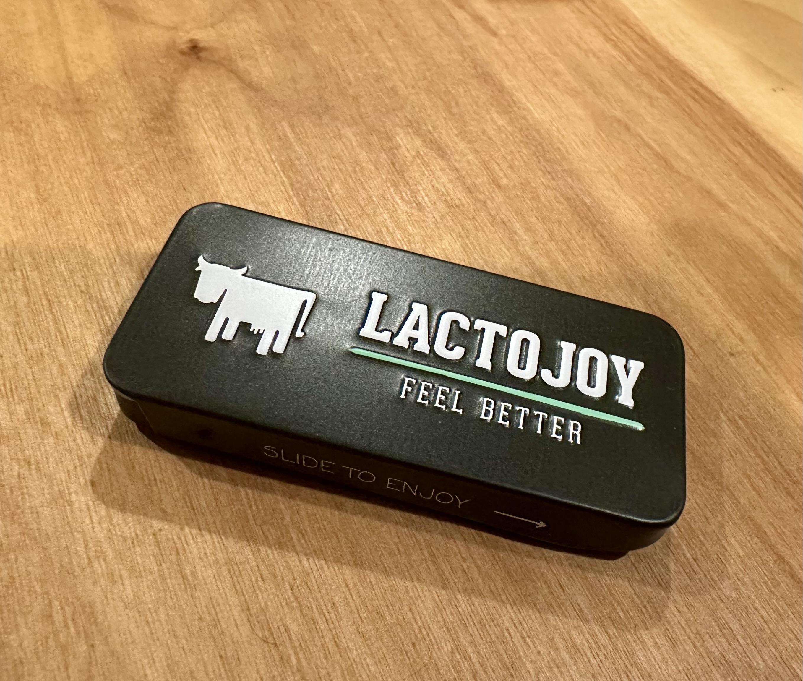 a photo of a tin that contains a lactase enzyme product called “LactoJoy” 
