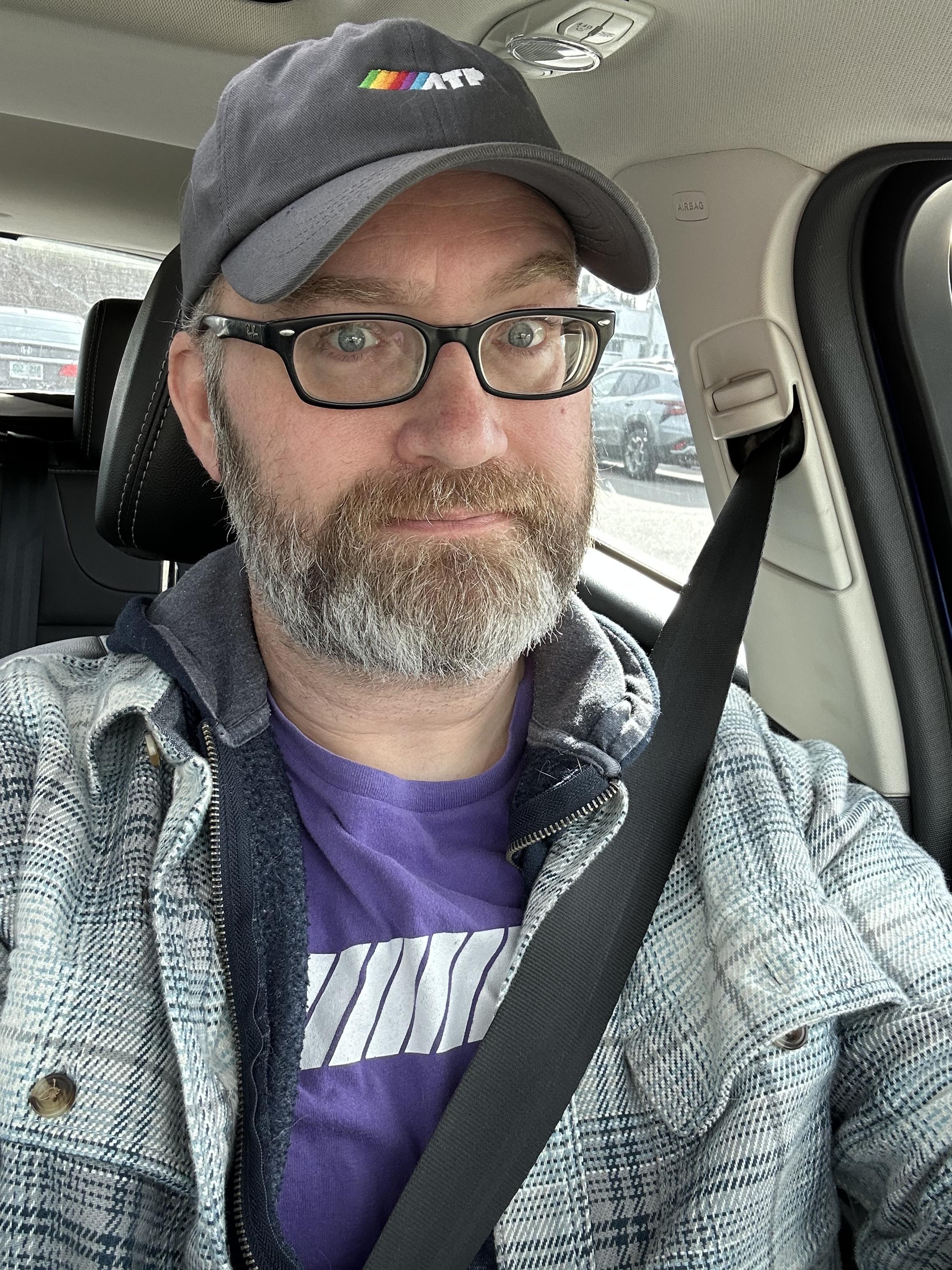 a selfie of me in my car wearing an atp.fm hat and an atp.fm t-shirt.