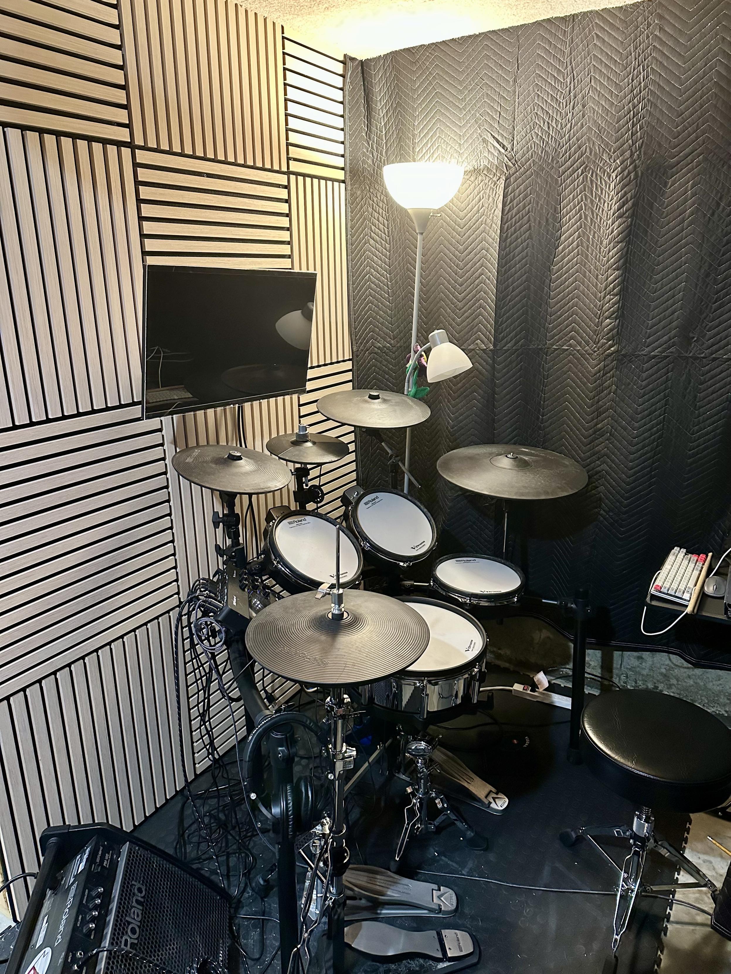 a photo of my son’s drum area in our basement, as described in the post