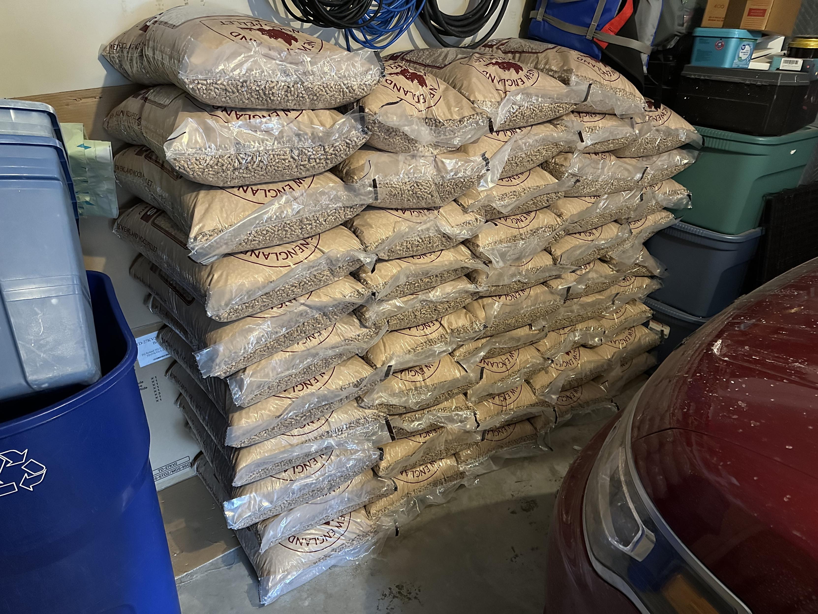 a photo of a ton of wood pellets, in 40 pound bags, stacked in my garage.