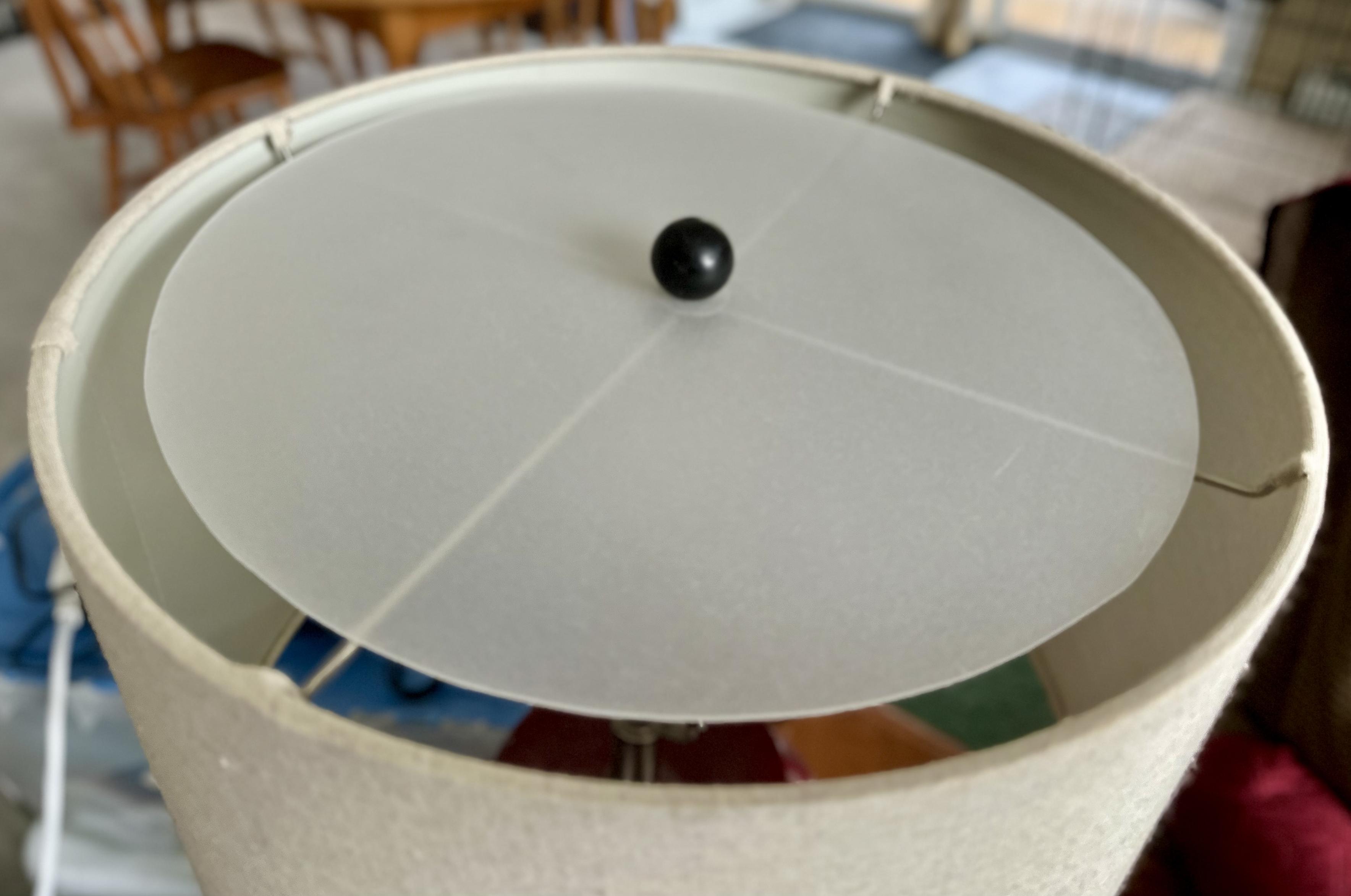 a photo of a round piece of frosted plexiglass mounted on top of a lamp shade