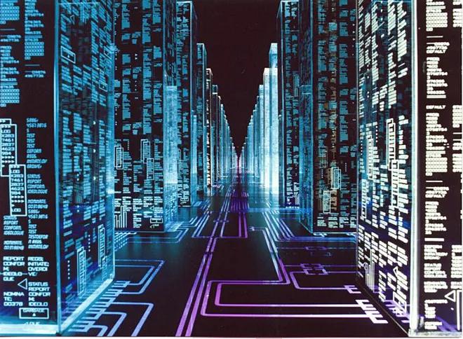 a screenshot of the film “Hackers” where the camera flies through “The Gibson” computer, which resembles a city