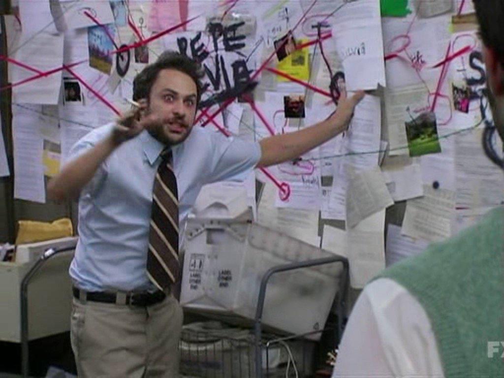 a meme image of Charlie from It’s Always Sunny in Philadelphia, photographed in front of a board with many documents posted on it, and red yarn connecting various points.