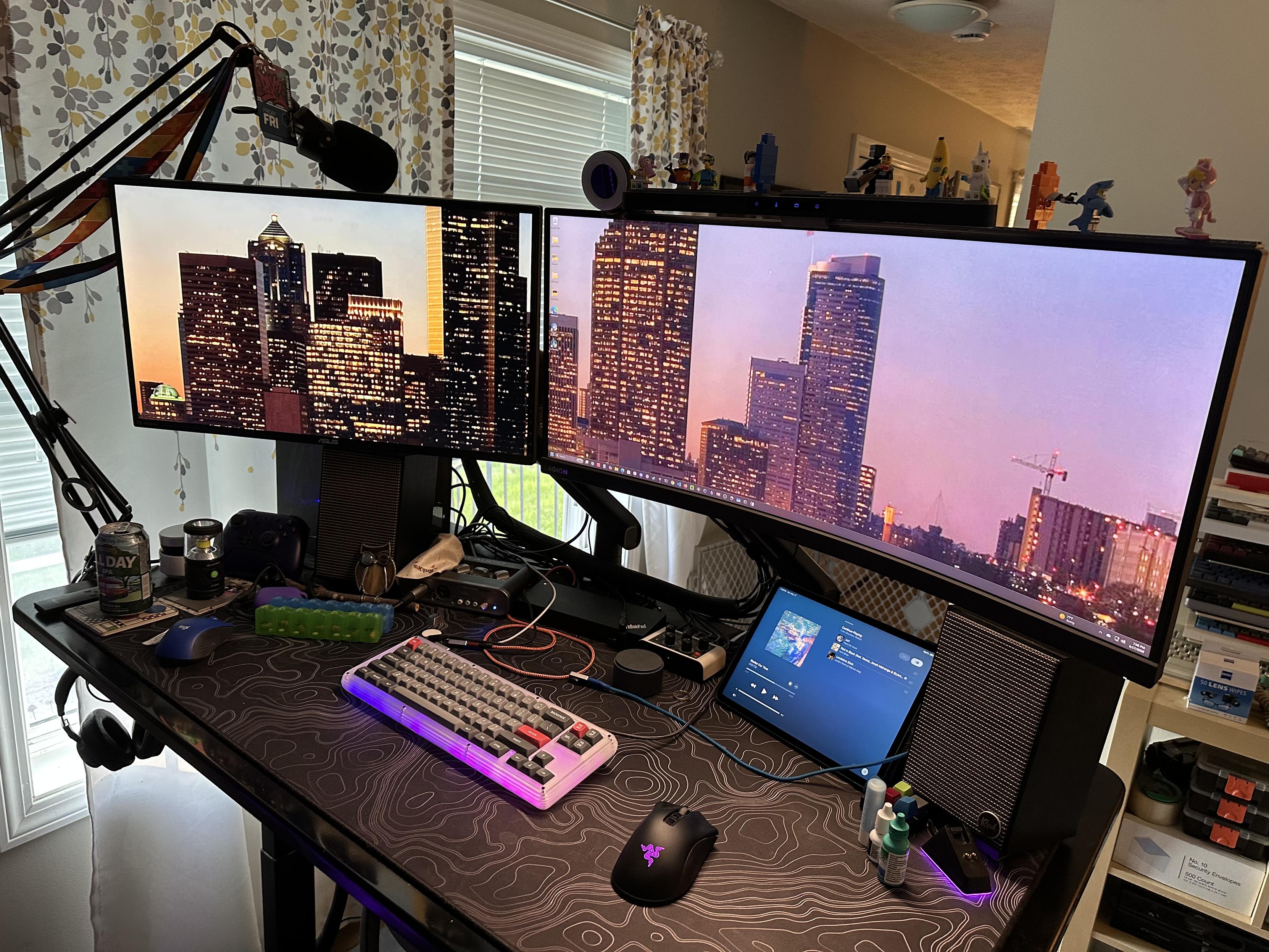 a photo of my desk with a 27” monitor and a 35” monitor next to each other.