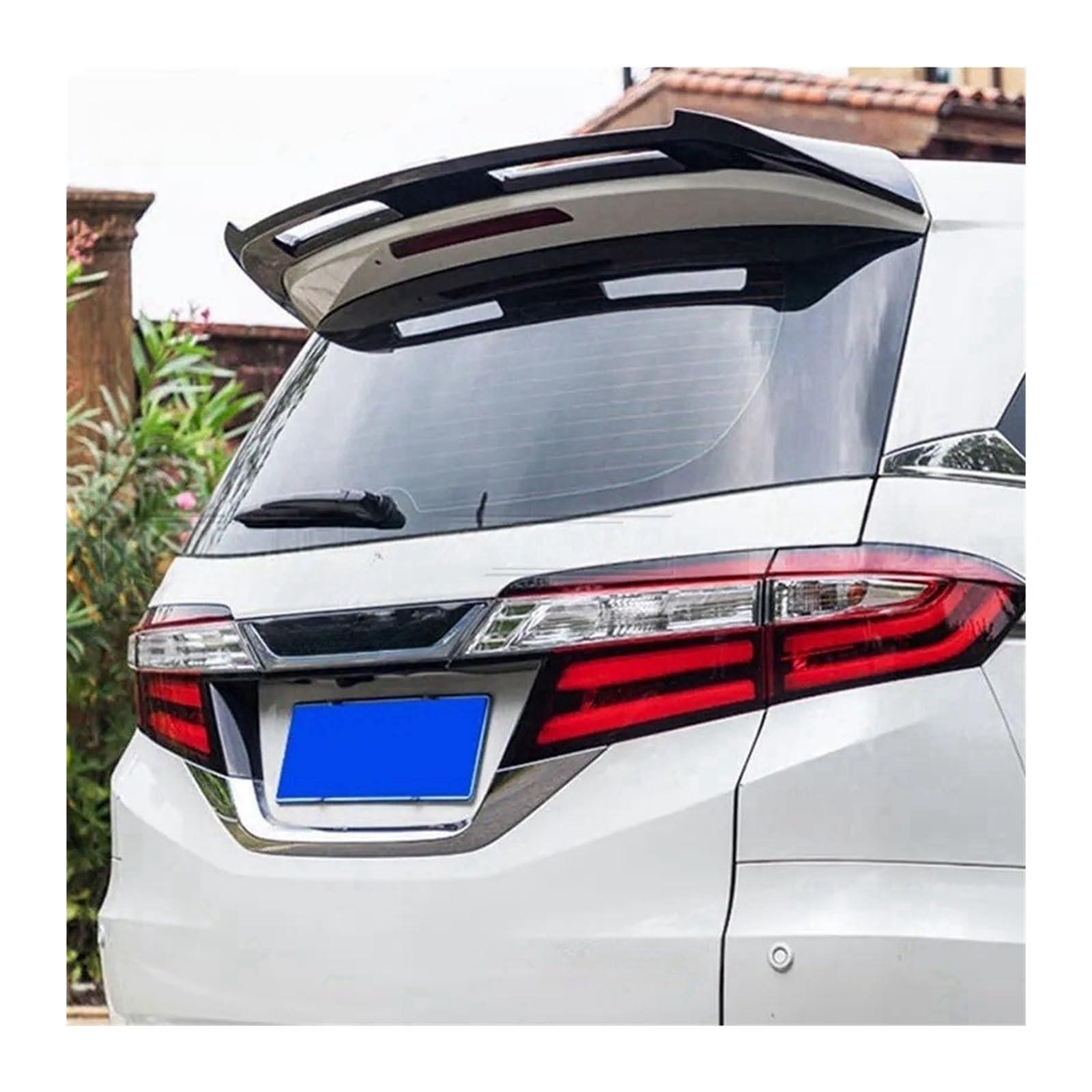 a photo of the back of a honda odyssey minivan with a spoiler installed 